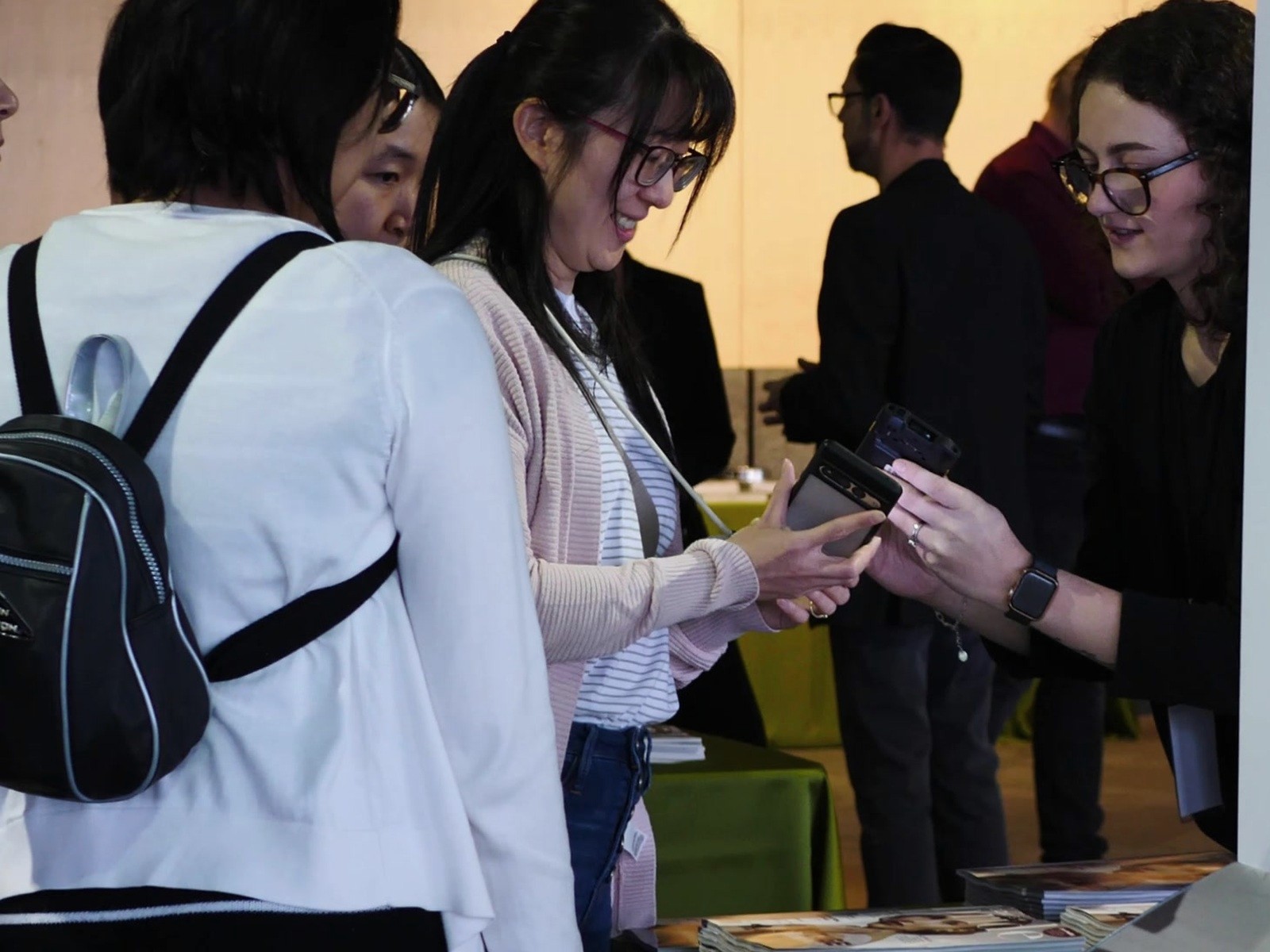 Wedding Fair attendees sharing information in person at an Edmonton event